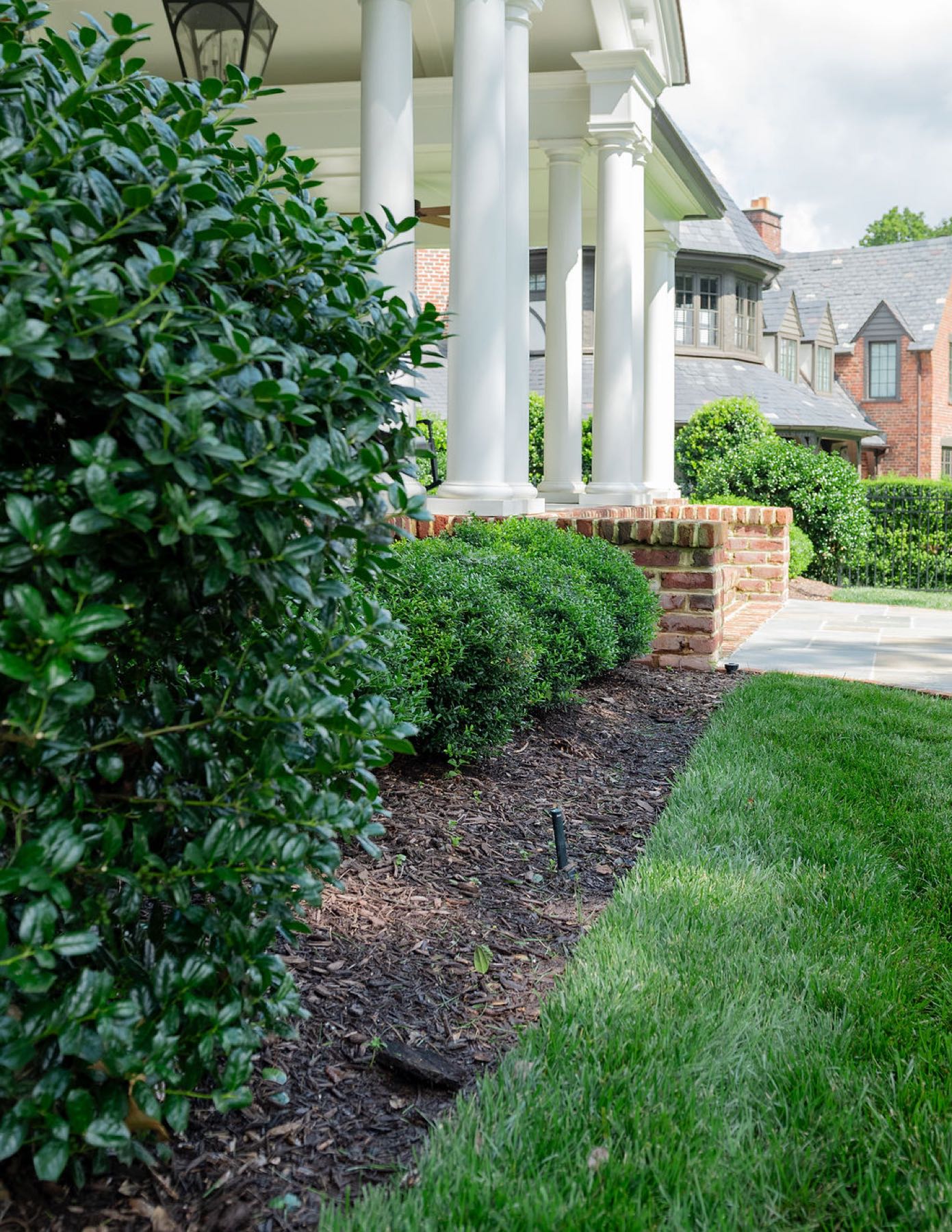 Boxwood detail at brick column